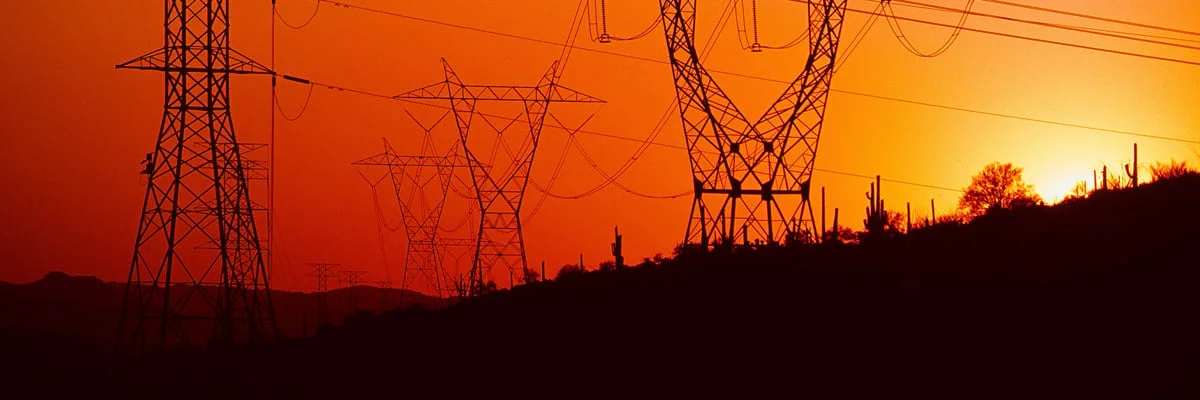 Power transmission towers at sunset